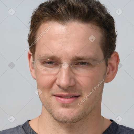 Joyful white adult male with short  brown hair and grey eyes