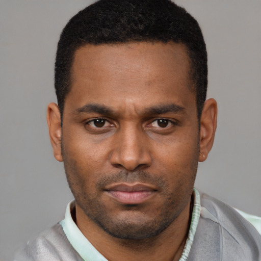 Neutral latino young-adult male with short  brown hair and brown eyes