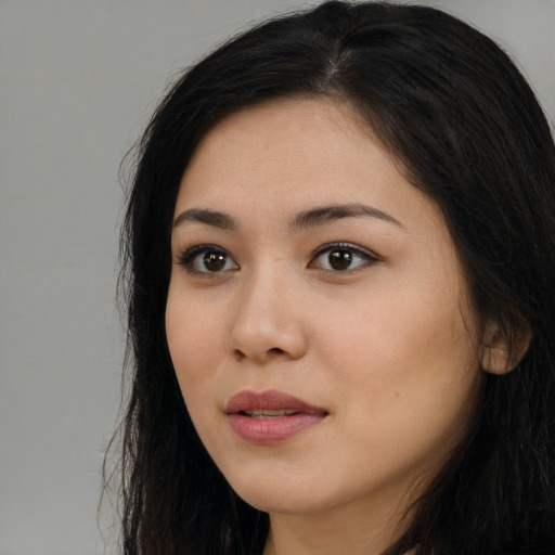 Neutral latino young-adult female with long  black hair and brown eyes