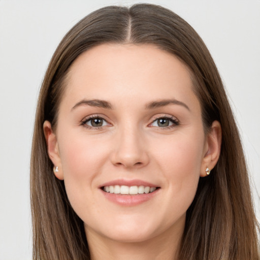 Joyful white young-adult female with long  brown hair and grey eyes