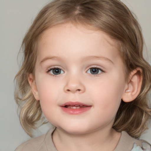 Joyful white child female with medium  brown hair and grey eyes