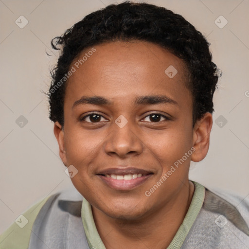 Joyful black young-adult male with short  brown hair and brown eyes