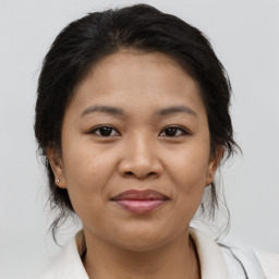 Joyful asian young-adult female with medium  brown hair and brown eyes