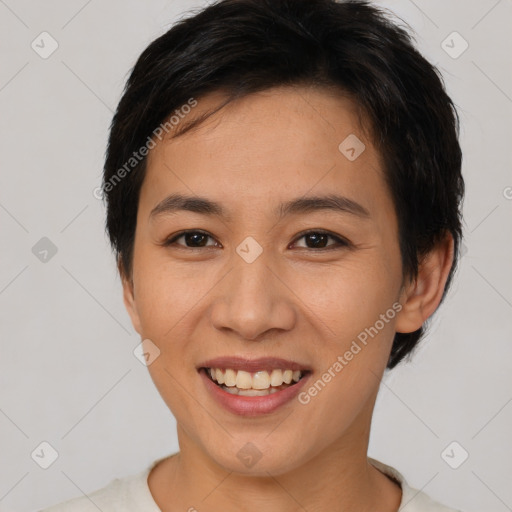 Joyful asian young-adult female with short  brown hair and brown eyes