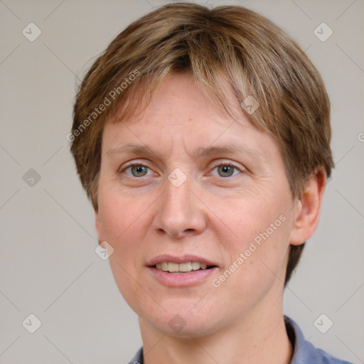 Joyful white adult female with short  brown hair and grey eyes