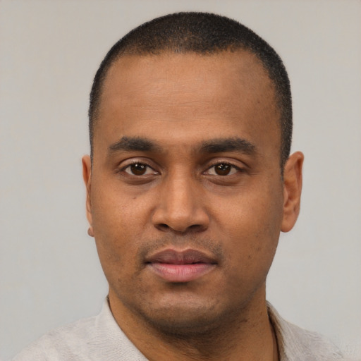 Neutral black young-adult male with short  black hair and brown eyes
