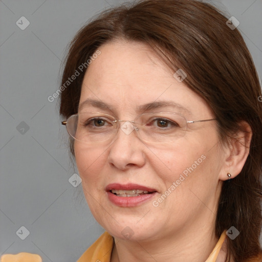 Joyful white adult female with medium  brown hair and brown eyes