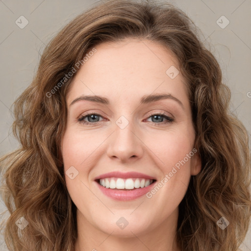 Joyful white young-adult female with long  brown hair and green eyes