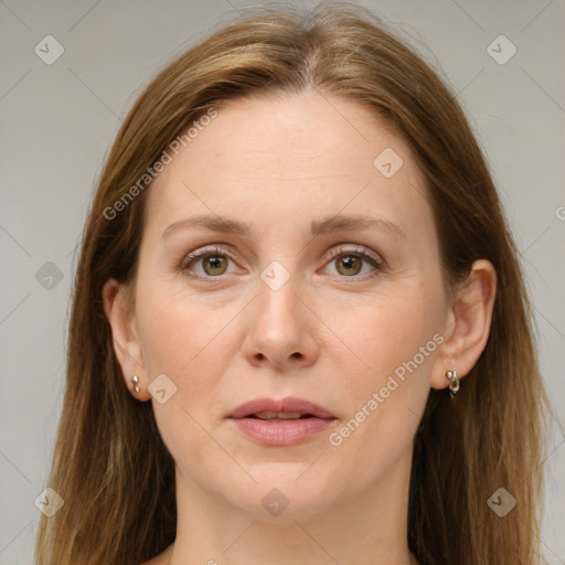 Joyful white adult female with medium  brown hair and grey eyes