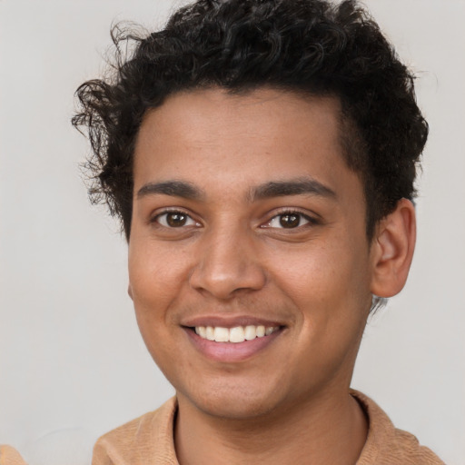 Joyful latino young-adult male with short  brown hair and brown eyes