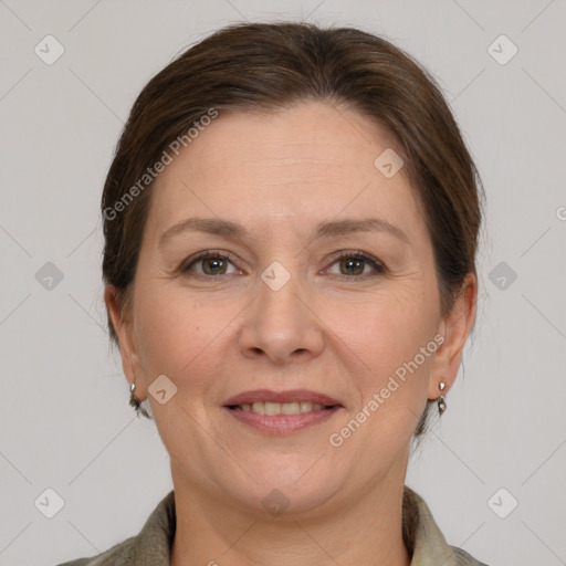 Joyful white adult female with medium  brown hair and grey eyes