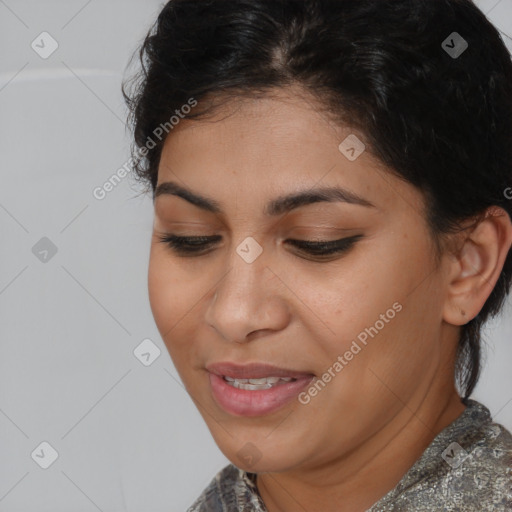 Joyful latino young-adult female with short  brown hair and brown eyes