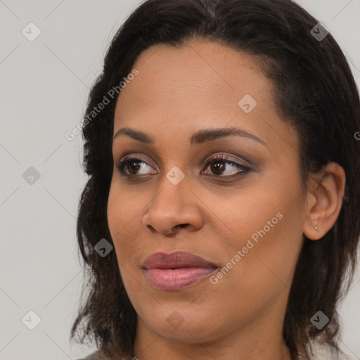 Joyful black young-adult female with medium  brown hair and brown eyes