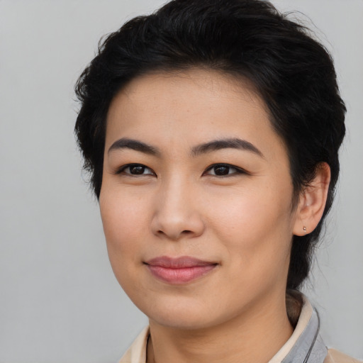 Joyful asian young-adult female with medium  black hair and brown eyes