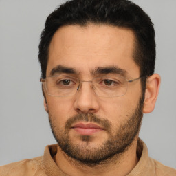 Neutral white adult male with short  black hair and brown eyes