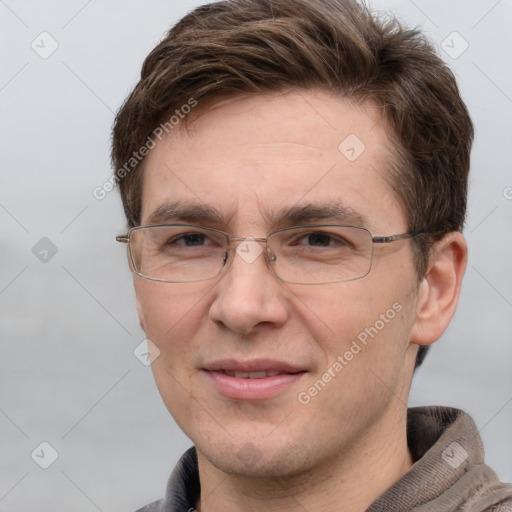 Joyful white adult male with short  brown hair and grey eyes