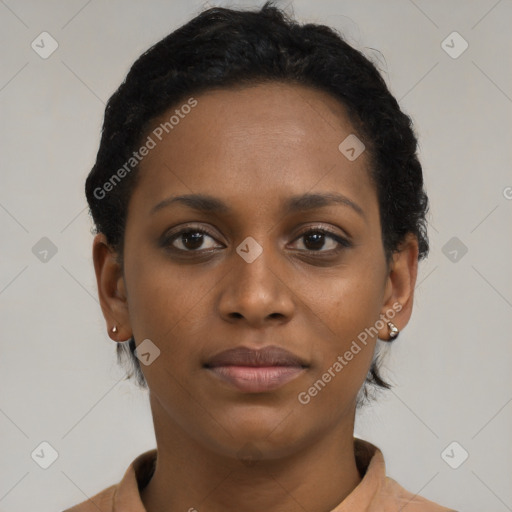 Joyful black young-adult female with short  brown hair and brown eyes