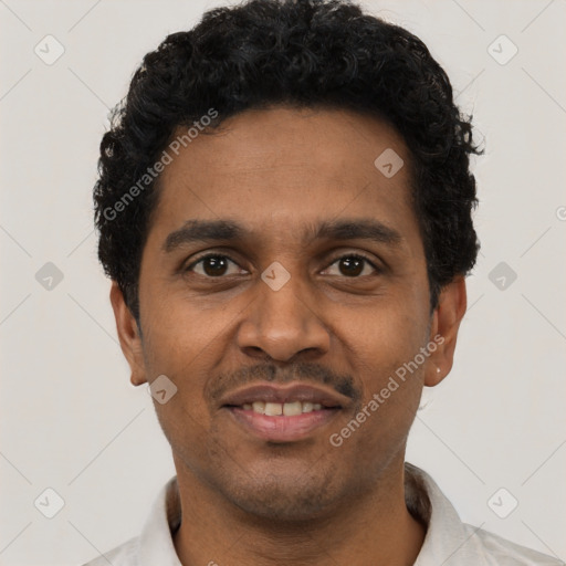 Joyful black young-adult male with short  black hair and brown eyes