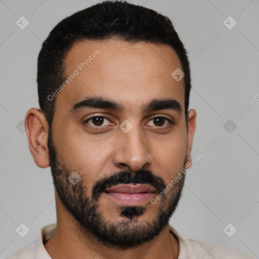 Joyful latino young-adult male with short  black hair and brown eyes