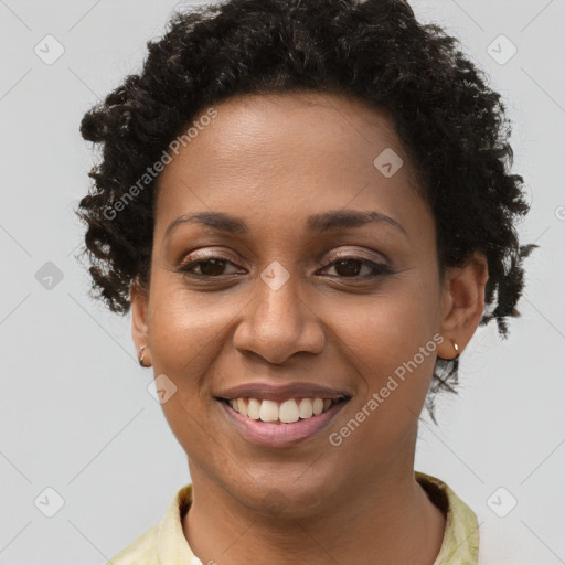 Joyful black young-adult female with short  brown hair and brown eyes