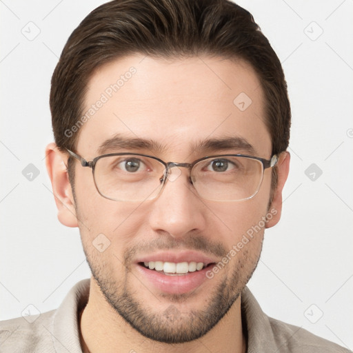 Joyful white young-adult male with short  brown hair and grey eyes