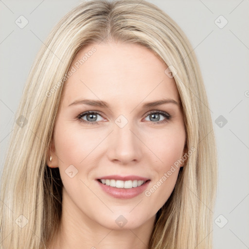 Joyful white young-adult female with long  brown hair and blue eyes