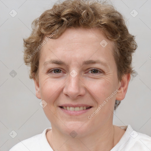 Joyful white adult female with short  brown hair and brown eyes