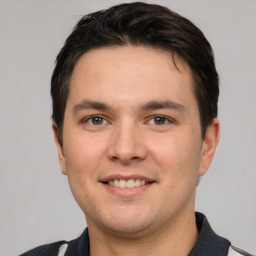 Joyful white young-adult male with short  brown hair and brown eyes