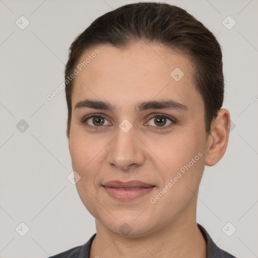 Joyful white young-adult female with short  brown hair and brown eyes