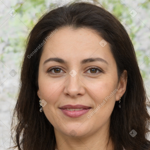 Joyful white adult female with long  brown hair and brown eyes