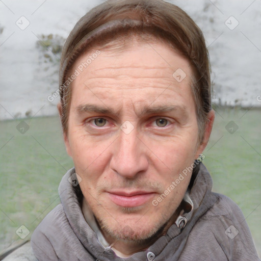 Joyful white adult male with short  brown hair and grey eyes