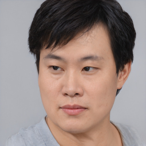 Neutral asian young-adult male with short  black hair and brown eyes