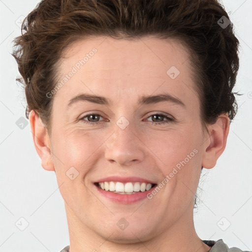 Joyful white young-adult female with short  brown hair and grey eyes