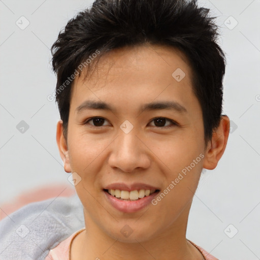 Joyful asian young-adult male with short  brown hair and brown eyes