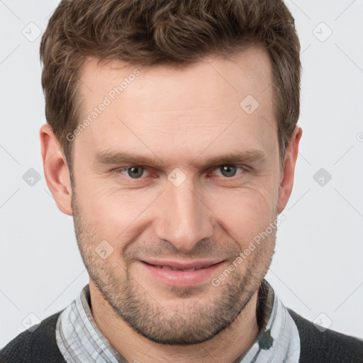 Joyful white adult male with short  brown hair and grey eyes