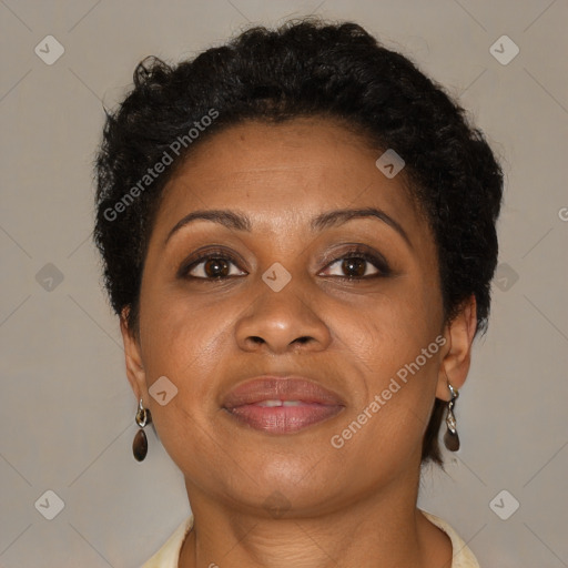 Joyful black adult female with short  brown hair and brown eyes