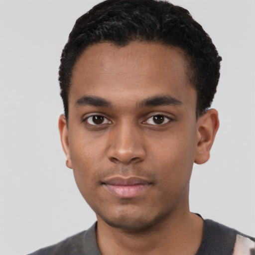 Neutral black young-adult male with short  black hair and brown eyes