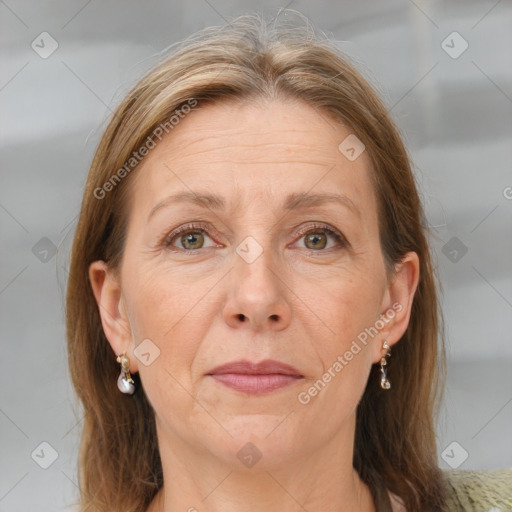 Joyful white adult female with medium  brown hair and grey eyes