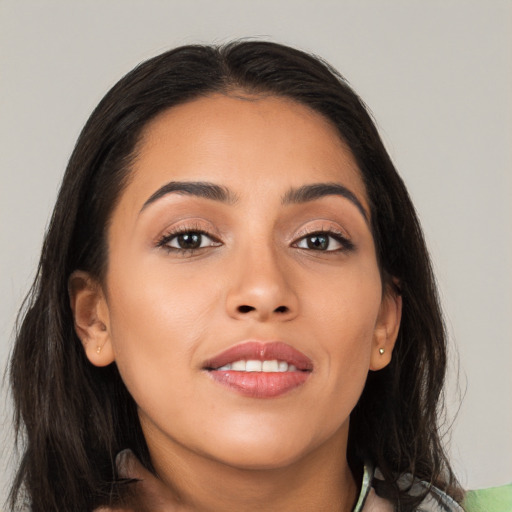 Joyful asian young-adult female with long  black hair and brown eyes