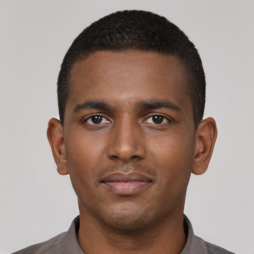 Neutral black young-adult male with short  brown hair and brown eyes