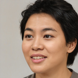 Joyful asian young-adult female with medium  black hair and brown eyes