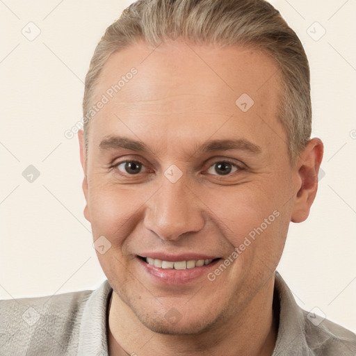 Joyful white adult male with short  brown hair and brown eyes