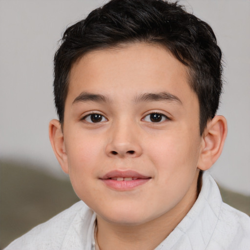 Joyful white child male with short  brown hair and brown eyes