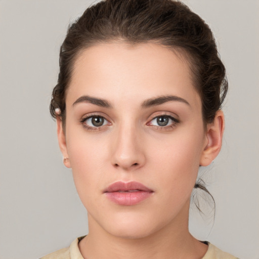 Neutral white young-adult female with medium  brown hair and brown eyes