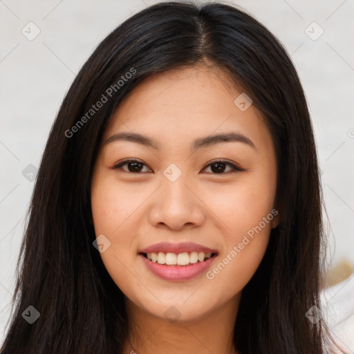 Joyful asian young-adult female with long  brown hair and brown eyes