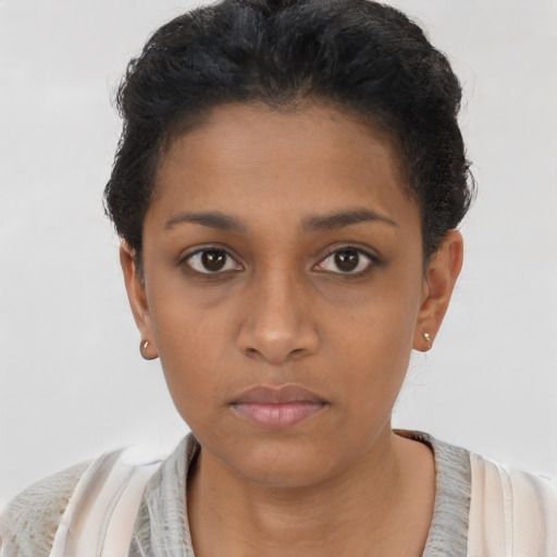Neutral black young-adult female with short  brown hair and brown eyes