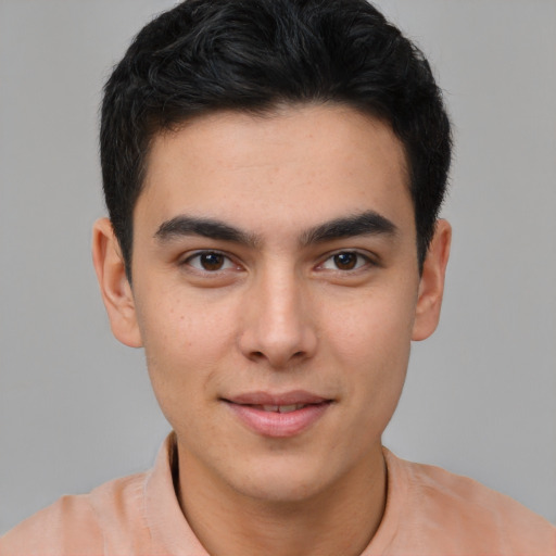 Joyful asian young-adult male with short  brown hair and brown eyes