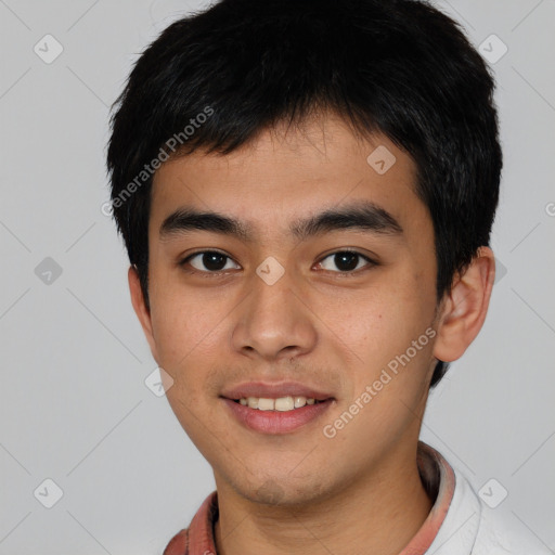 Joyful asian young-adult male with short  black hair and brown eyes