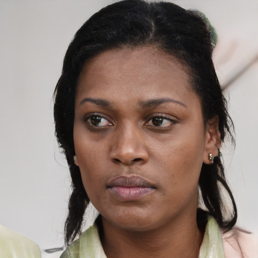 Neutral black young-adult female with medium  black hair and brown eyes