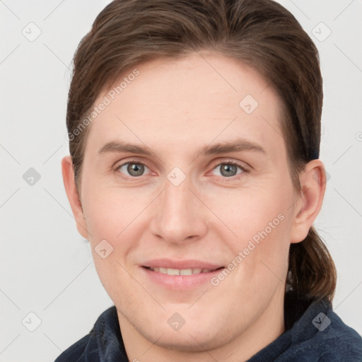 Joyful white young-adult female with short  brown hair and grey eyes